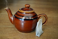Teapot On Wooden Background