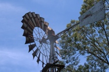 Wheel Of Windmill Against The Sky