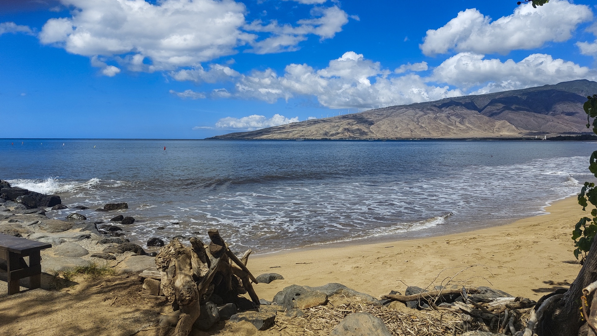 landscape view of the sand, sea, mountains, clouds and blue sky of Maui, Hawaii