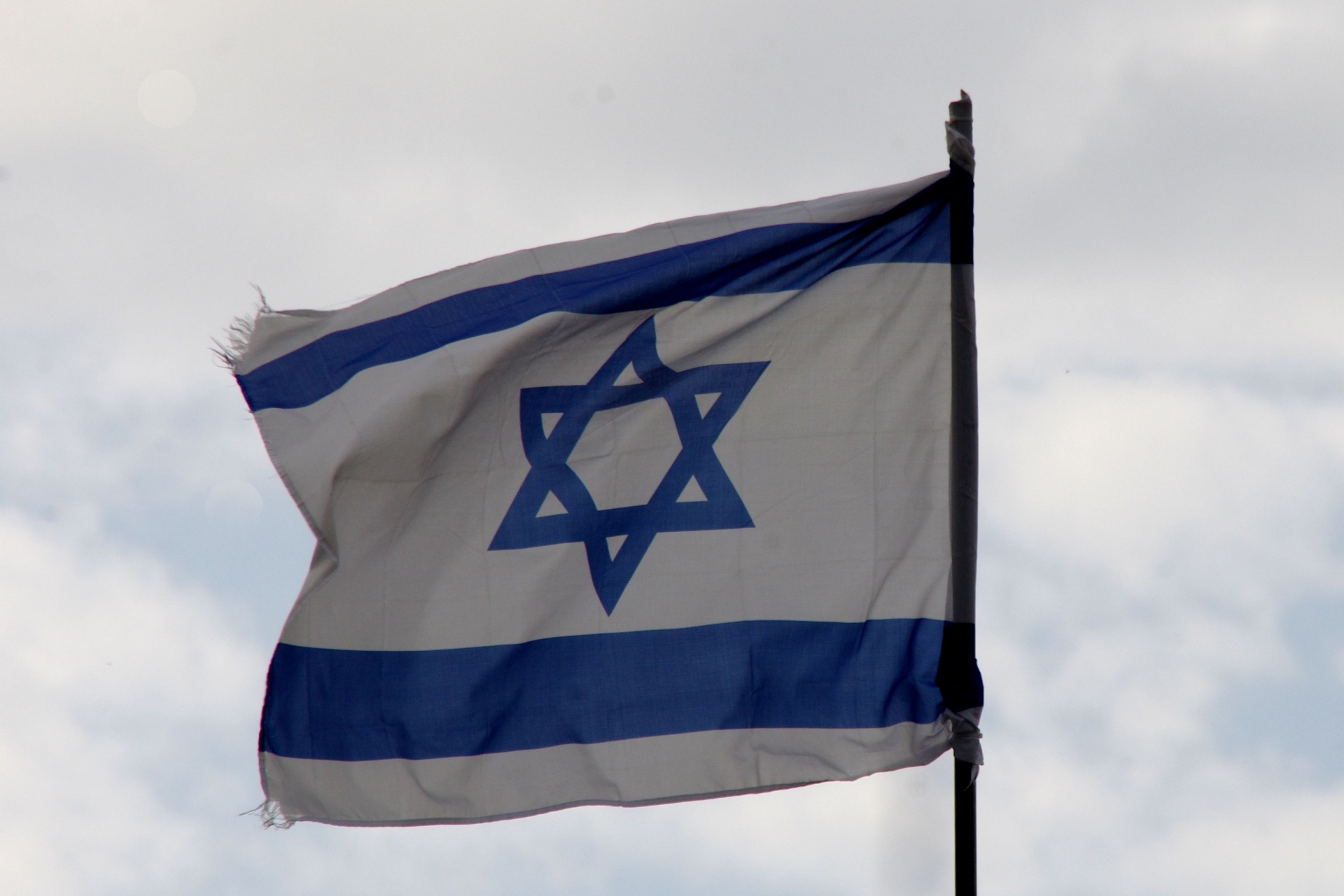 Old Israeli Flag Waving Bravely