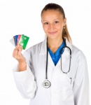 Doctor Holding Credit Cards