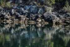 Mirrored Reflection Of Rocks