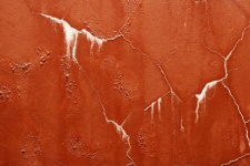 White Stained Cracks On Red Texture