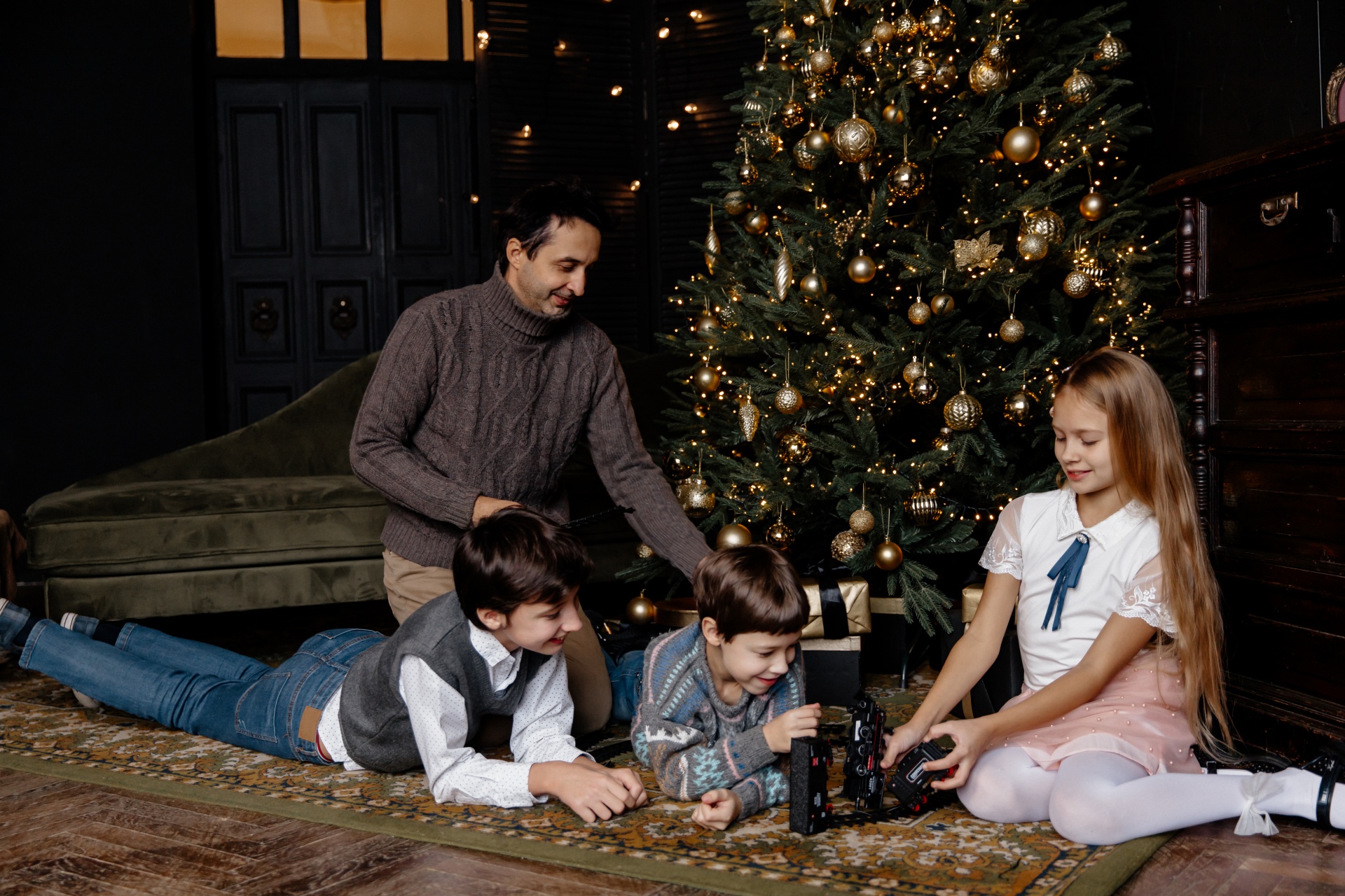 father, dad, boys, girl, brothers, sisters, children, family, railroad, toys, christmas, new year, holiday, tree, gifts, congratulations, december 31, evening, living room, decorations, party