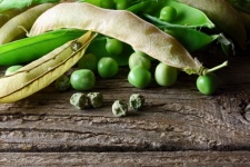 Dry Peas On Wooden Board With Pods