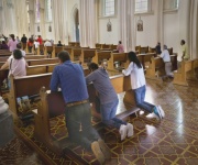 People Praying In Church.