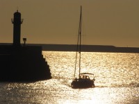 Lighthouse And Sailboat