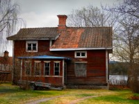 Worn Red Wooden House