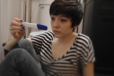 Teen Girl Looking At Pregnancy Test