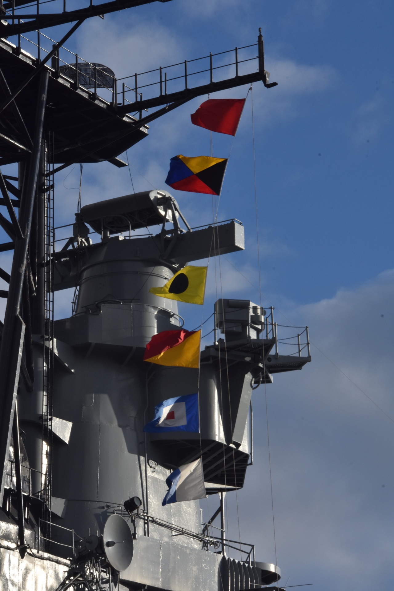 flags flying from the Battleship Iowa docked in San Pedro, California