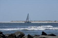 Sailboat Cruising At The Inlet