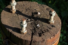 Screw And Bolts On A Wooden Post