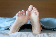 Male Bare Feet In Bed
