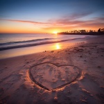 Valentine Heart In Sand By Ocean
