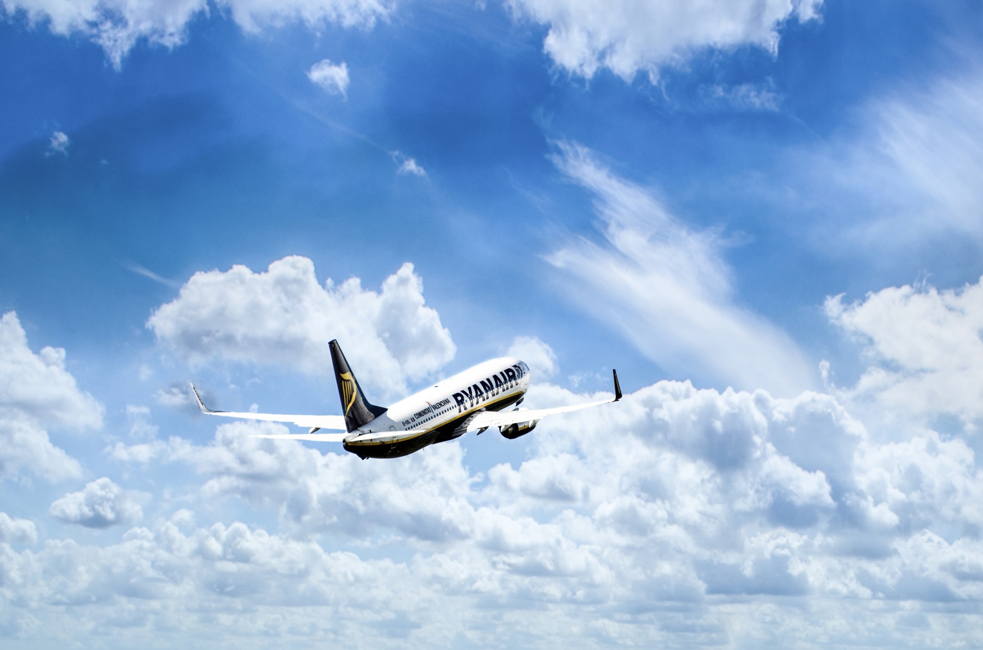 Jet Plane In A Blue Cloudy Sky