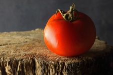 Ripe Red Tomato On A Wooden Surface