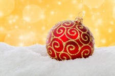 Red Christmas Ball In Snow