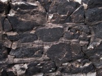 Stone Wall Blackened By Fire