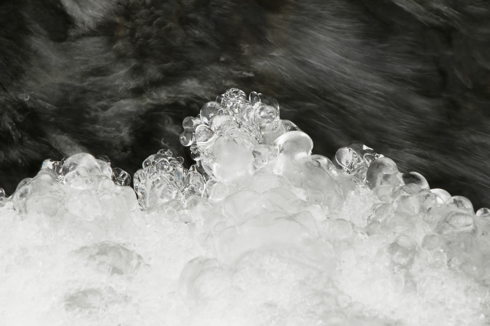 Ice over running water abstract background