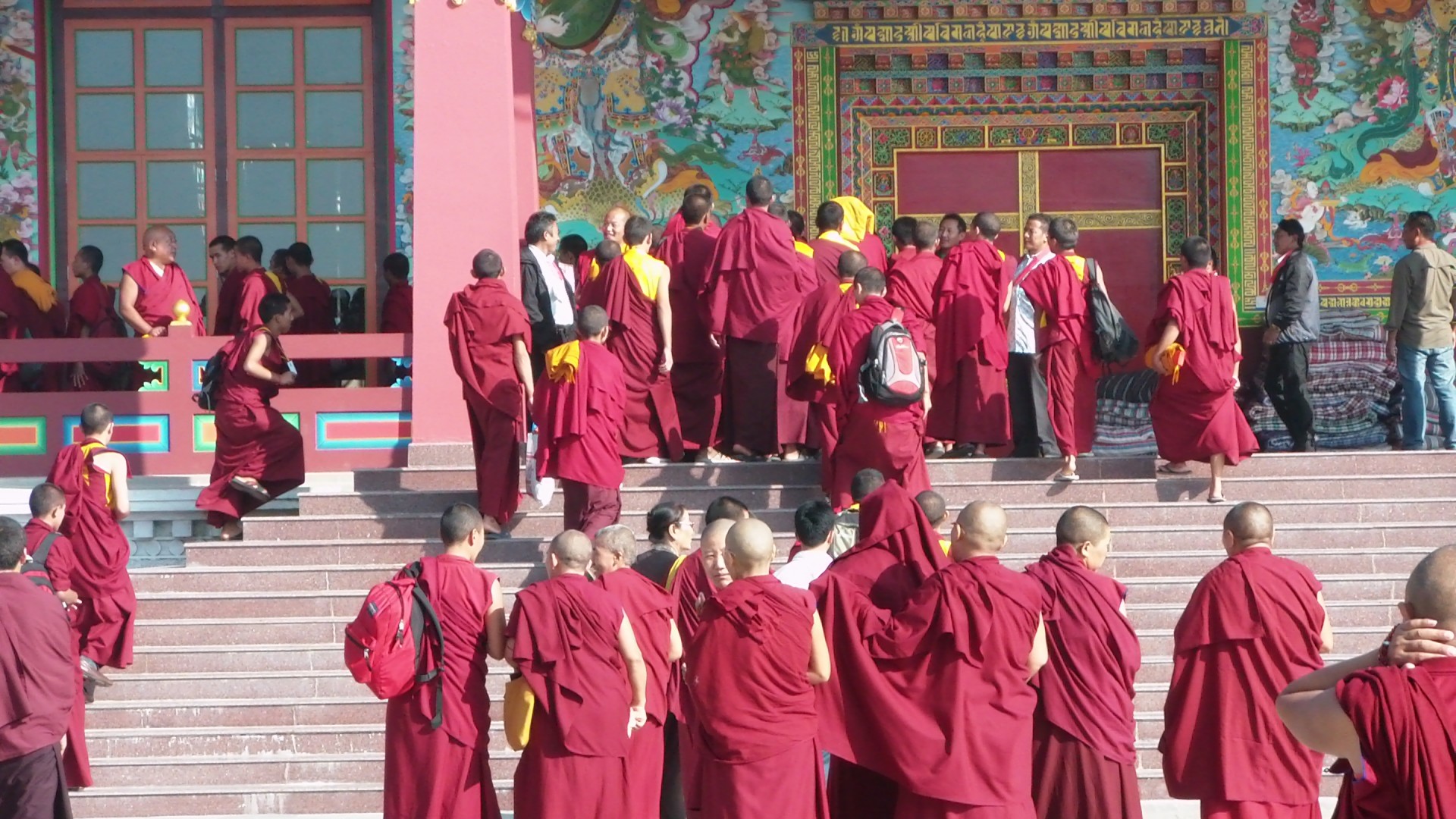 Gathering of Buddhist monks at a monastery. They were gathering for a ceremony to commemorate a Llama who passed away.