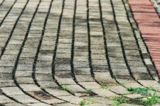 Curving Grey And Red Paving