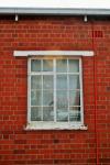 Red Brick Wall And White Window