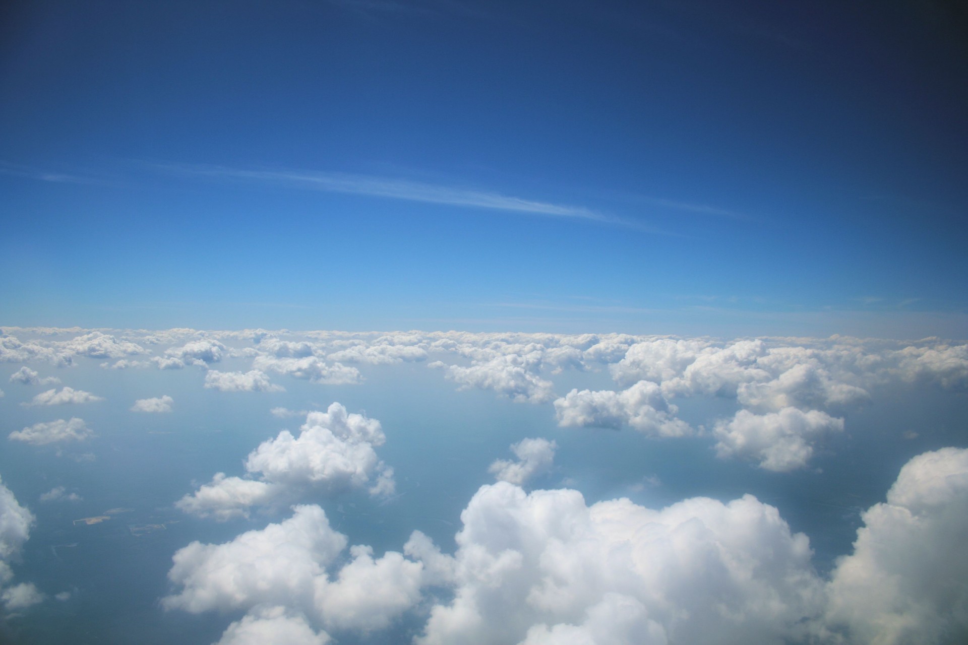 I love how the clouds look way up in a airplane looking out, and they are below you.