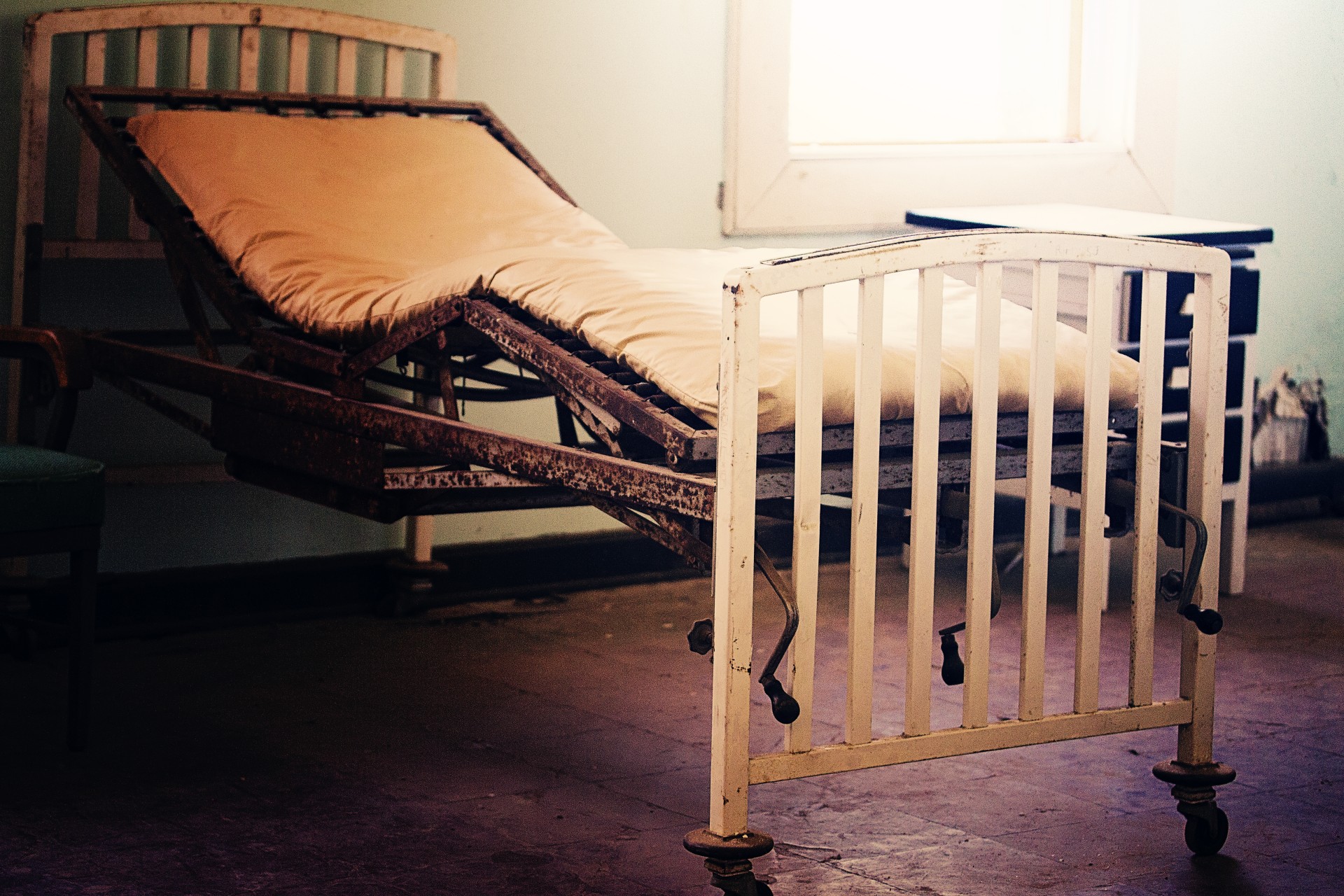 An old hospital bed in an abandoned building