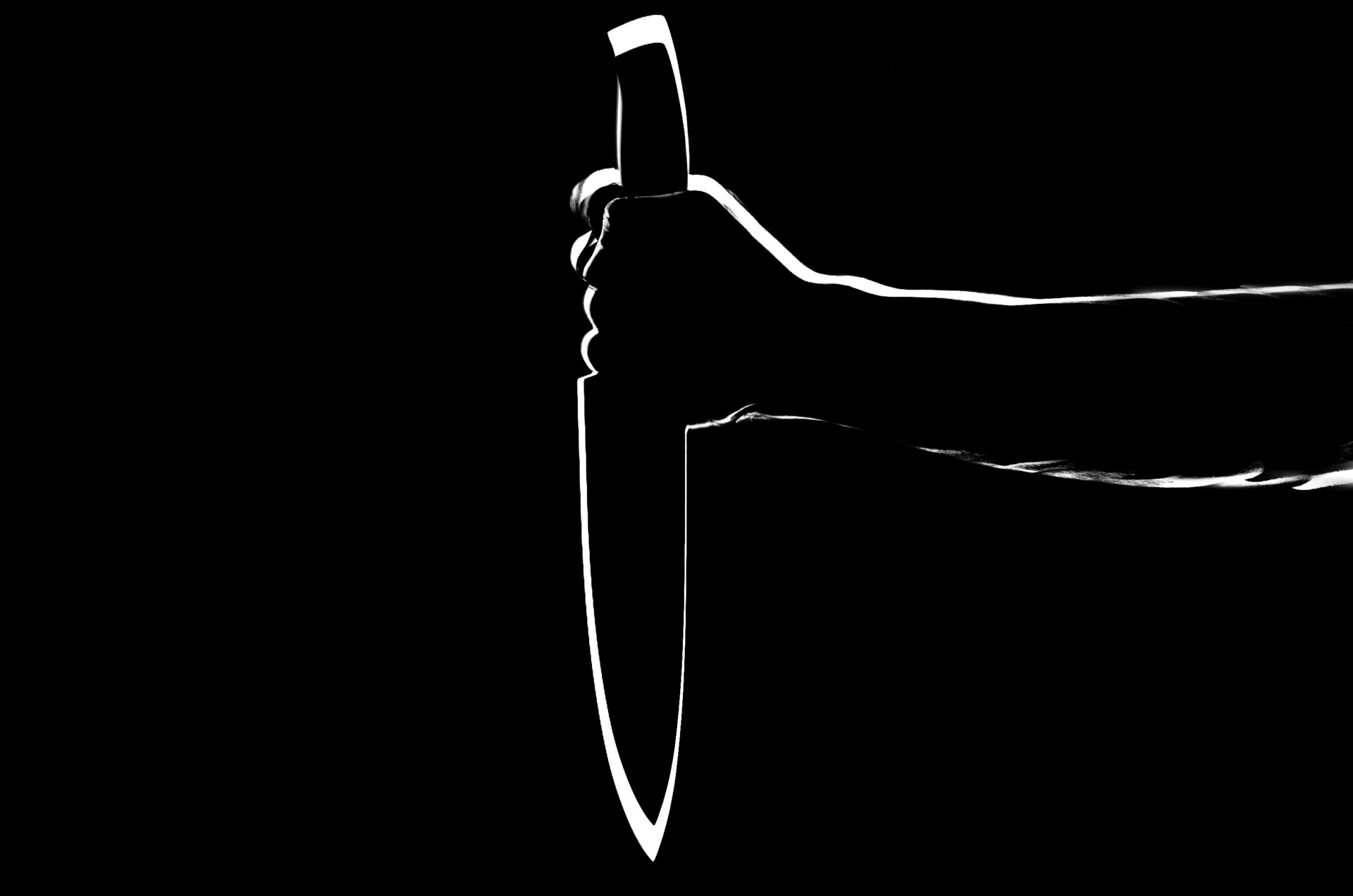 Silhouette Of Hand With Knife