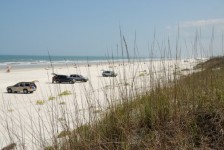 Cars Parked On The Beach