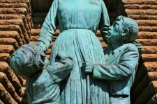 Close Up Of Boy And Girl In Statue