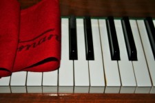 Piano With Red Filt Cover