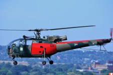 Red & Camo Alouette Iii Taking Off