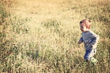 Small Boy Running In Field