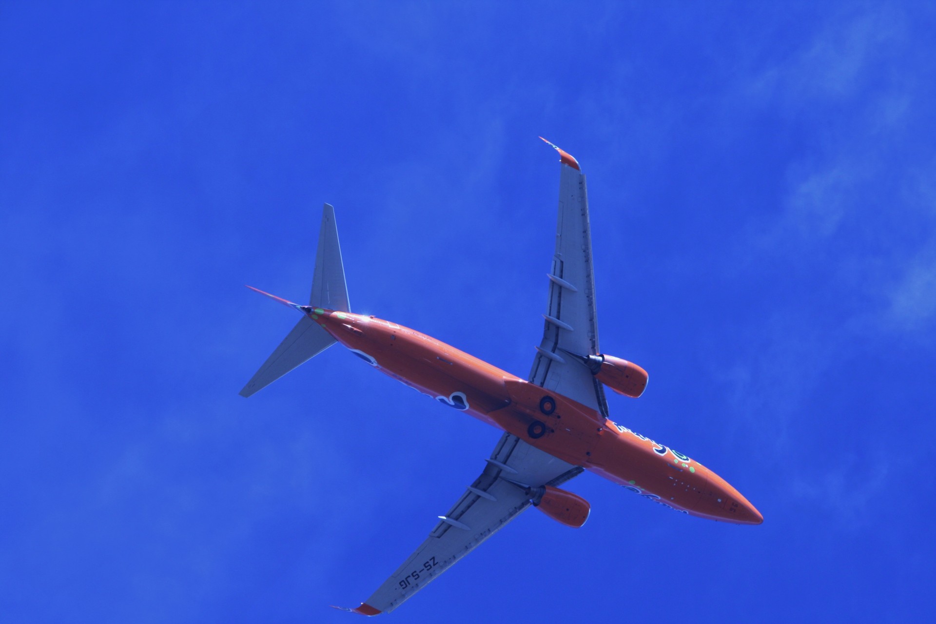 Mango B-737 Against The Blue Sky