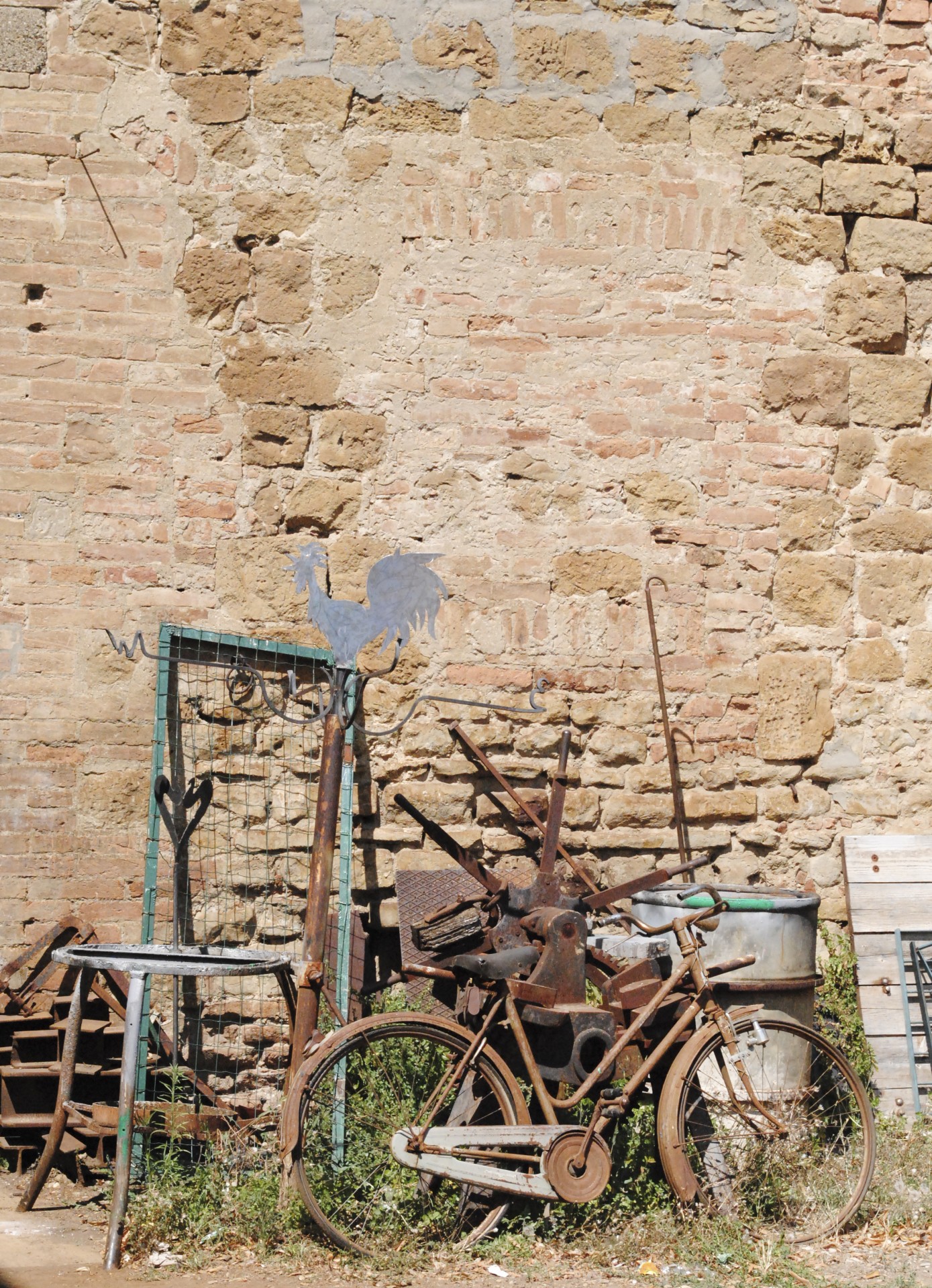 Objects accumulated in a courtyard in Tuscany