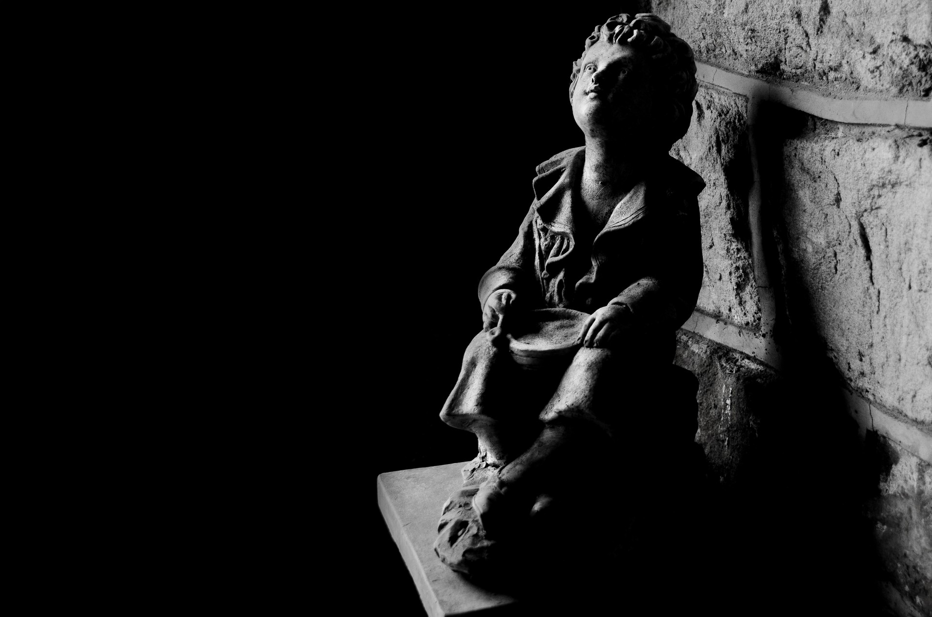 Sculpture Of A Child In The Shade